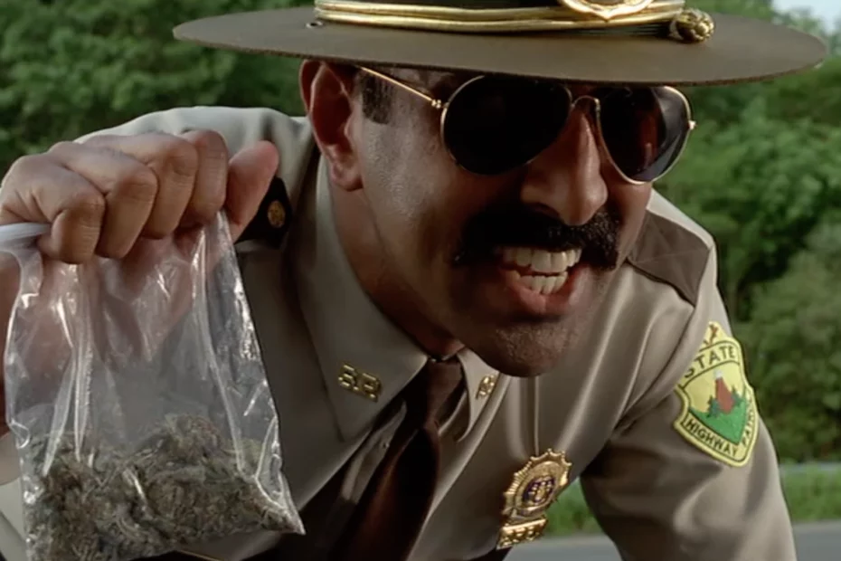 Police officer holding bag of weed